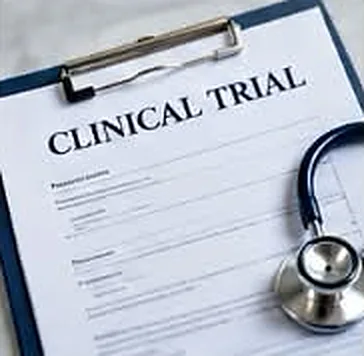 A clipboard titled Clinical Trial, with a stethoscope